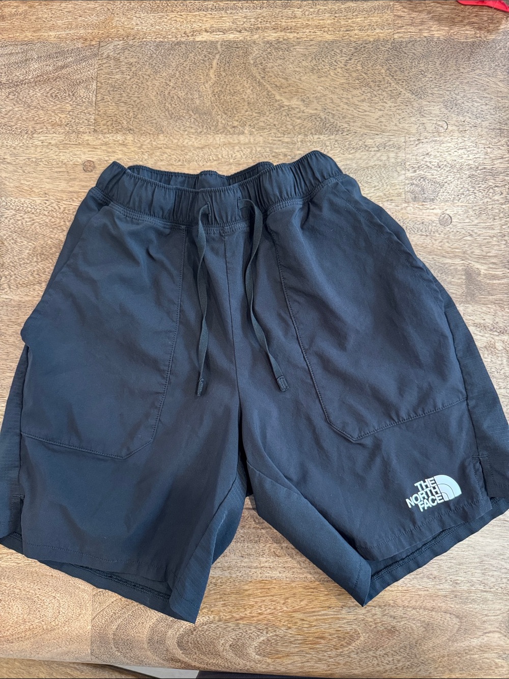 Men’s Northface shorts. Size small.  Liner was cut out.